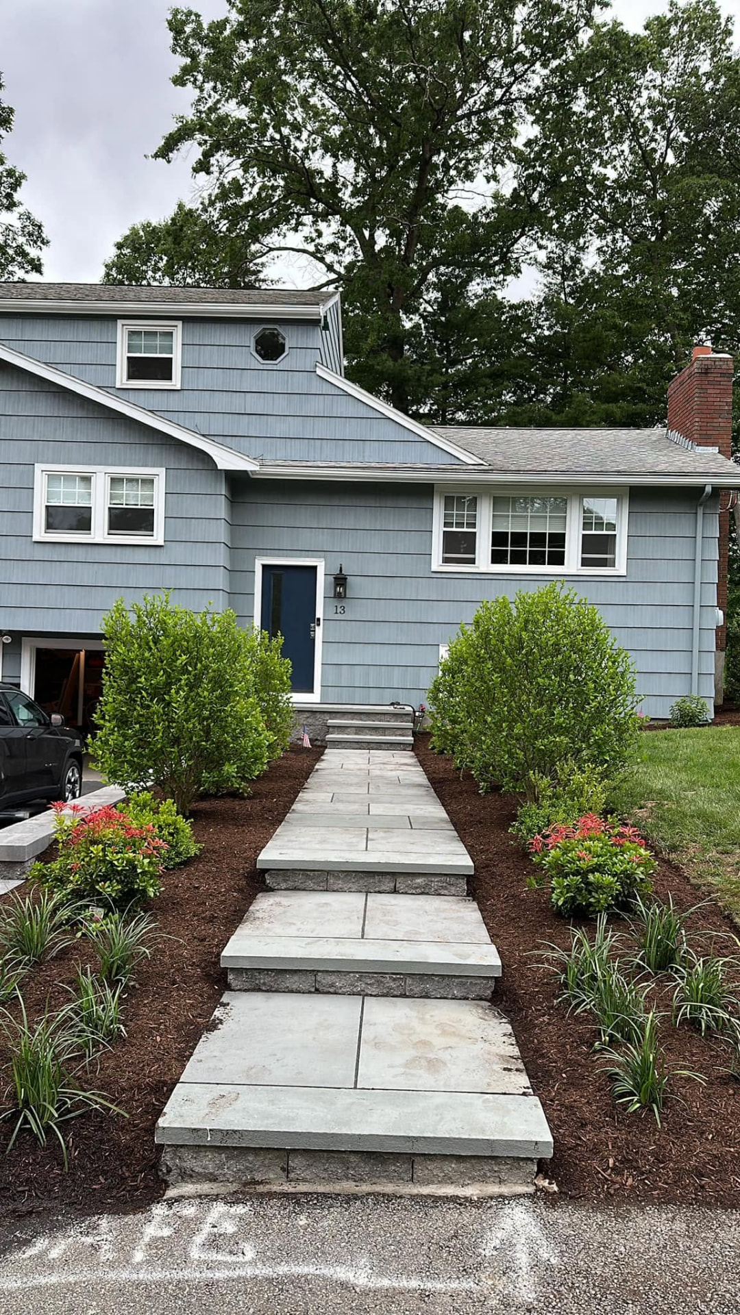 Bluestone walkway leading to the front door of a New England home
